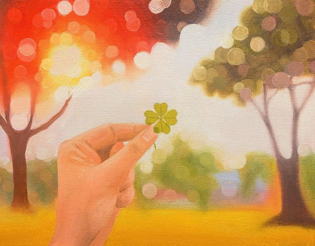Painting of a hand holding a four-leaf clover