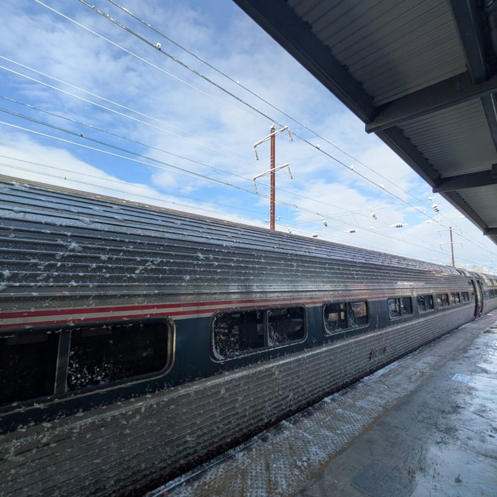Snow-dusted train at station